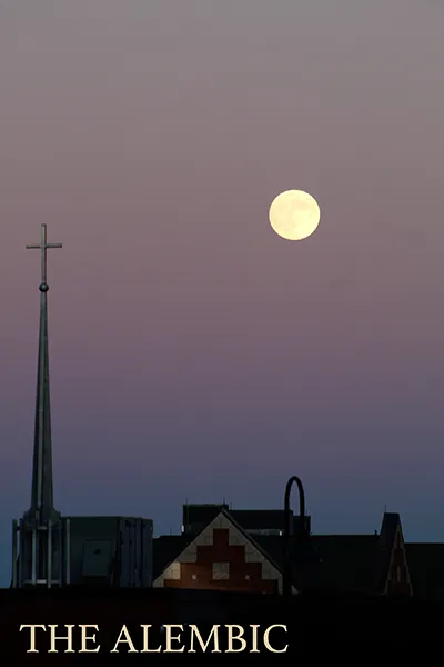 The Alembic Journal 2025 cover- a church steeple with the moon in the background
